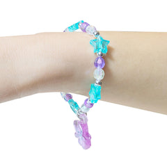 Close-up of pink star emblem on LUV HER Stitch Play jewelry