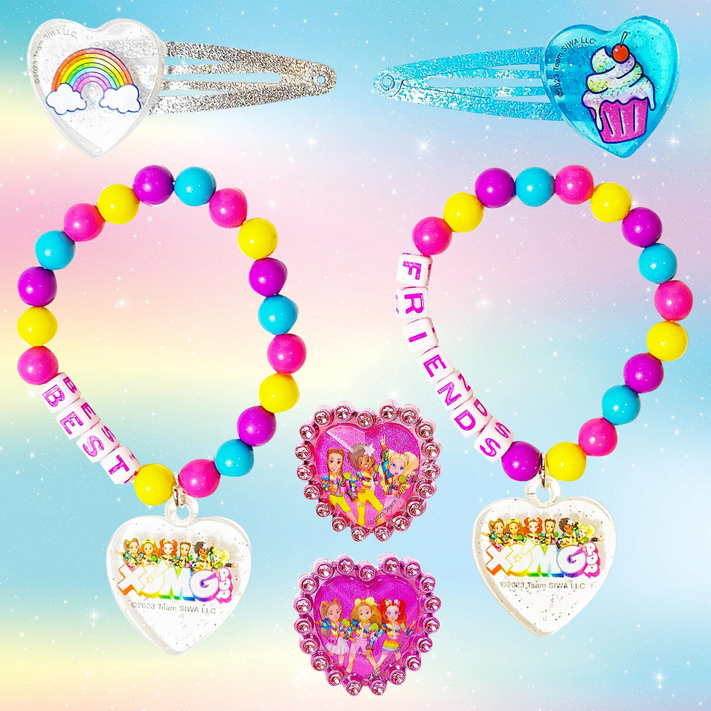 LUV HER XOMG POP ring pair closeup highlighting sparkly finishes for pretend-princess moments.