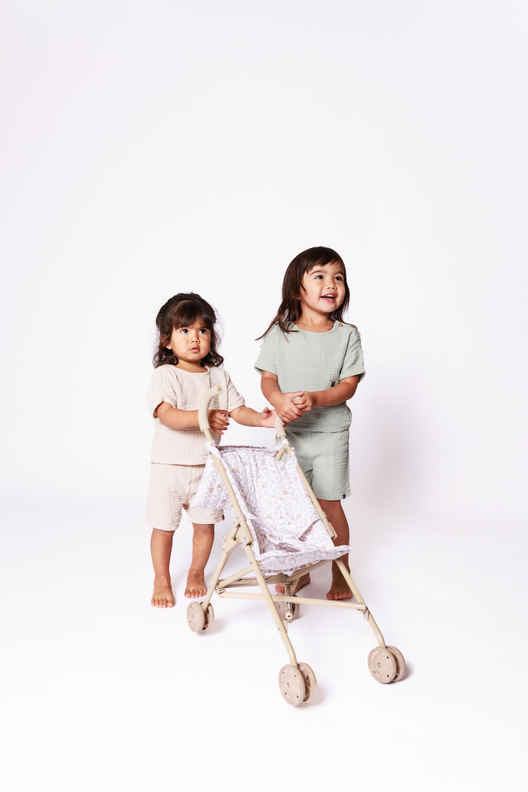 Beige and white floral print adds elegance to pretend play sets.
