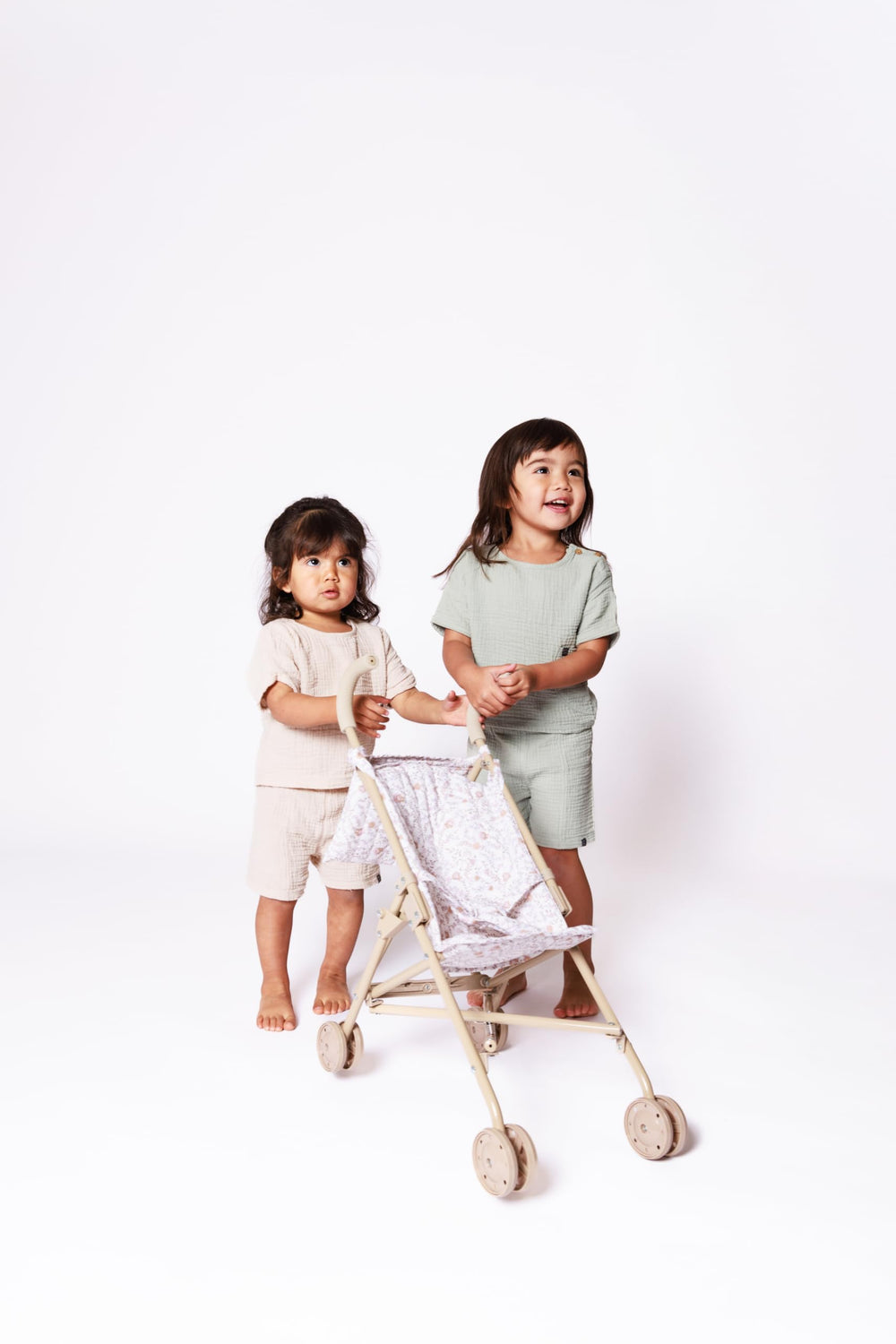 Beige and white floral print adds elegance to pretend play sets.