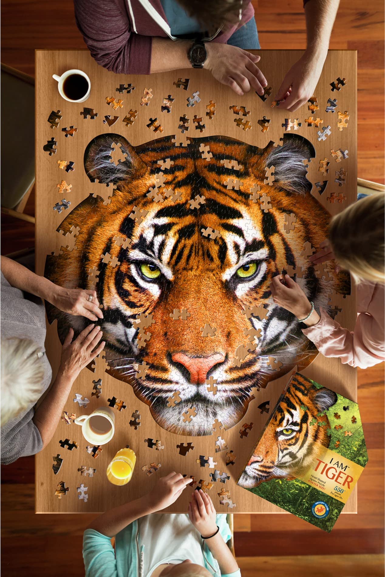 Madd Capp five-sided box packaging keeps puzzles neatly stored on a shelf.