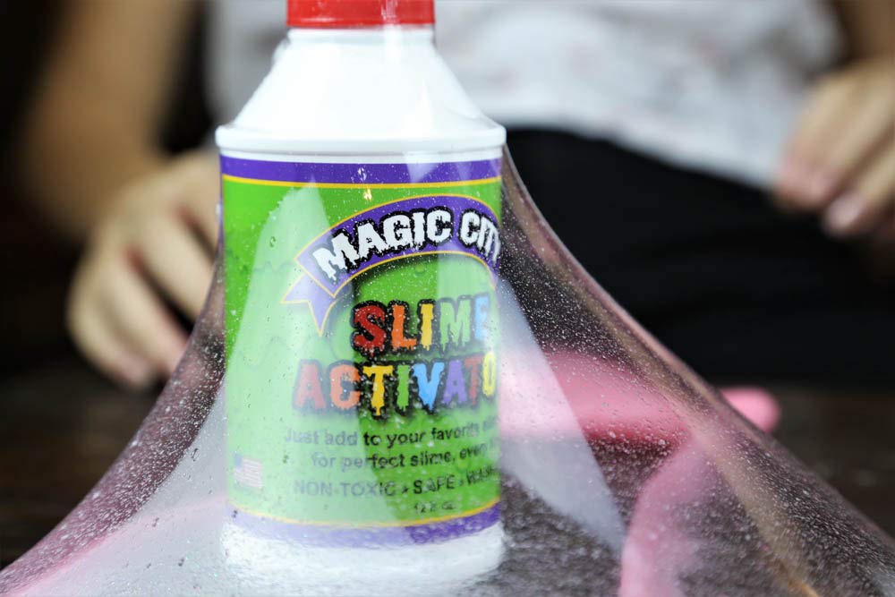Ready-to-use Magic City Slime Activator jar displayed for fast slime making.
