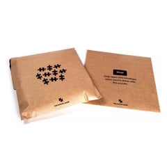 Magic Puzzle Company Drippy Trip packaging uses resealable envelopes for sharing.