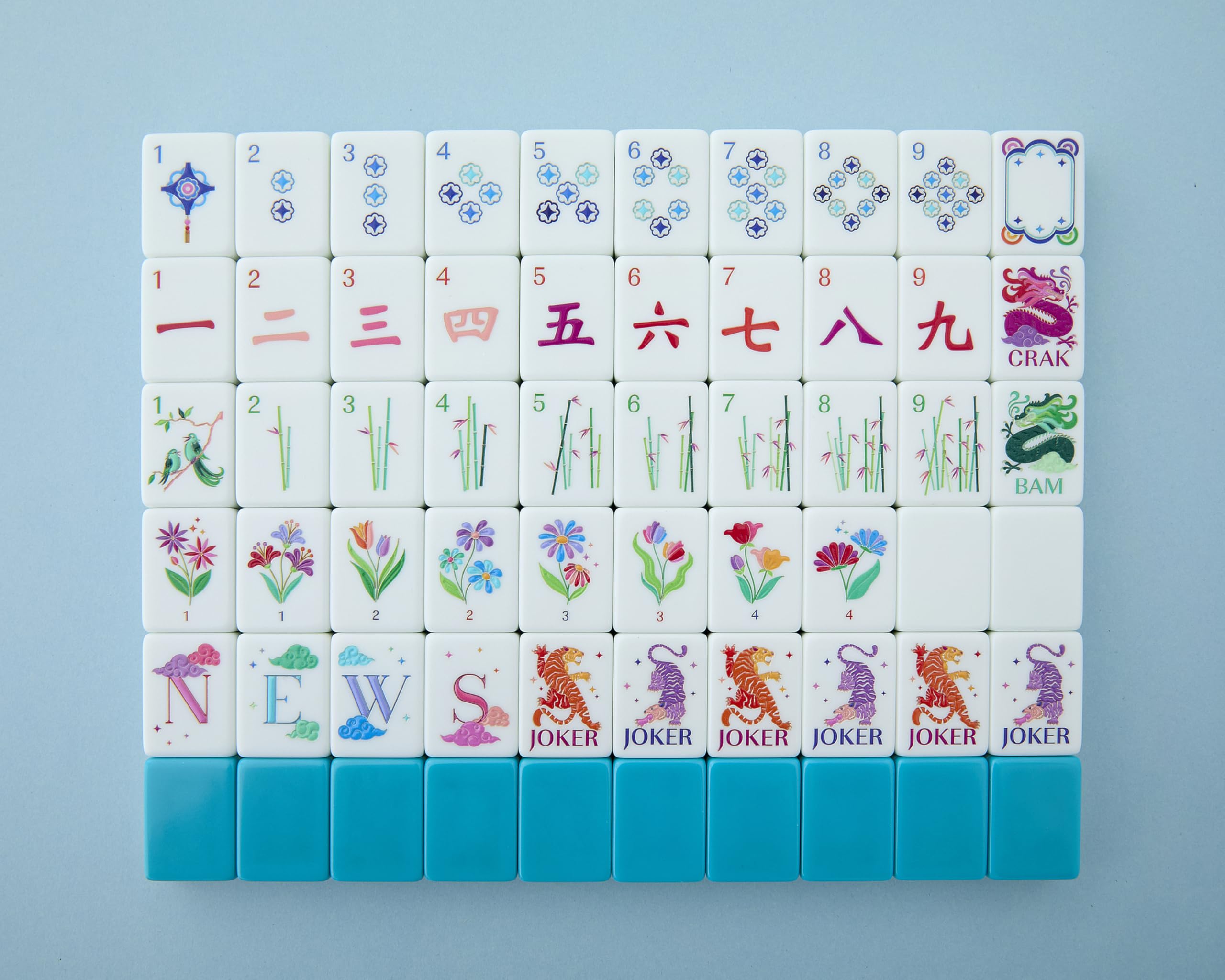 Mahjong Co Celestial tiles with teal-backed design for elegant gameplay.