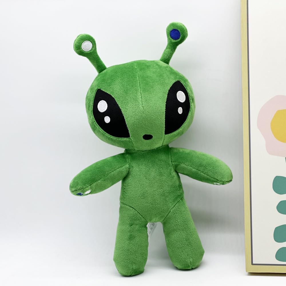 MAIPAI green alien plush on bed, ready for cozy storytime and hugs.