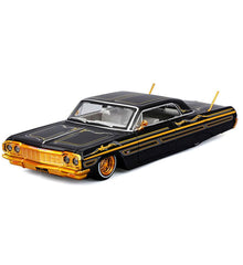 Maisto 32547BK diecast Impala lowrider side view with black gold graphics.
