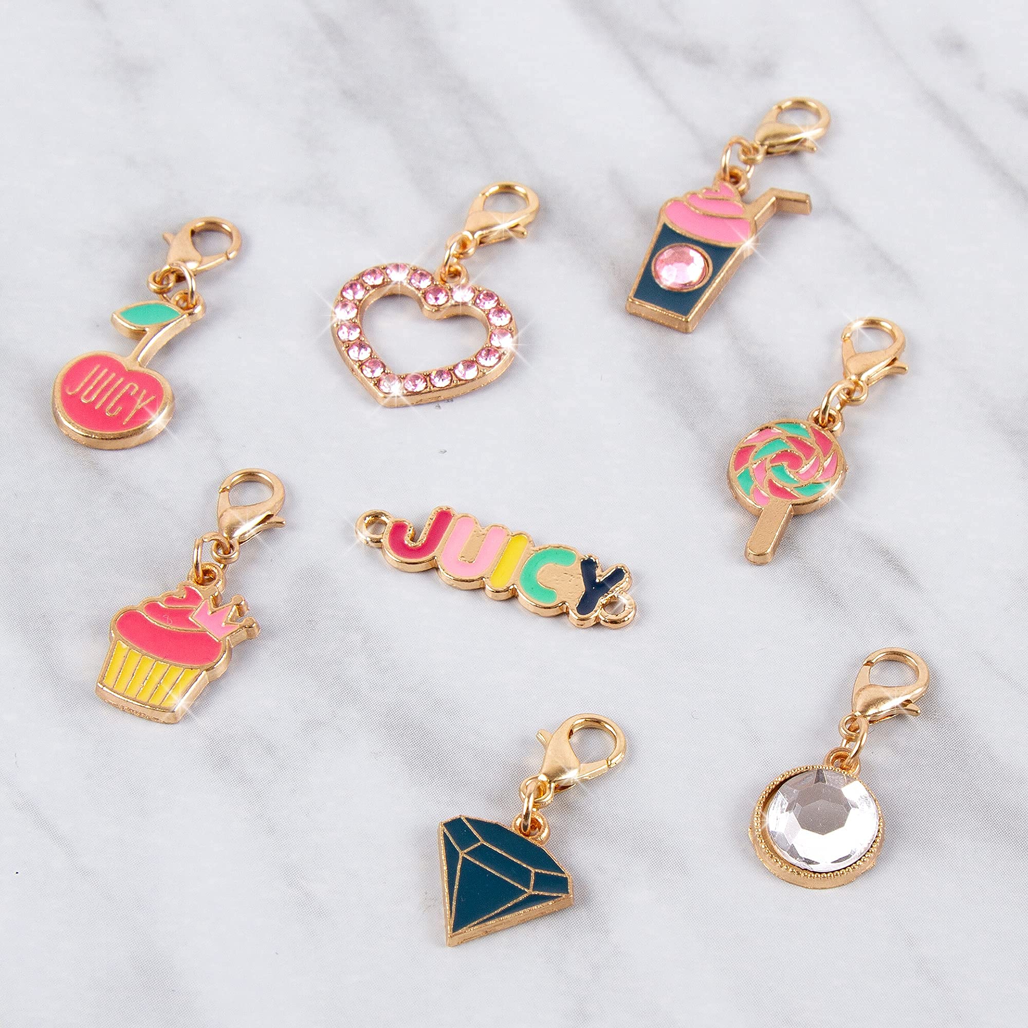Juicy Couture ear clips add playful detail to creations