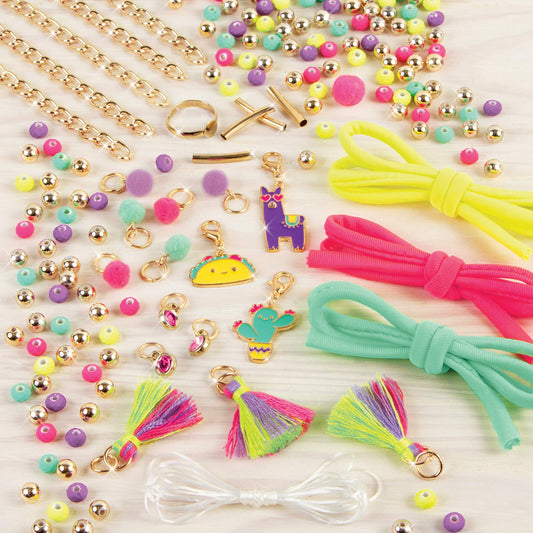 Neo-Brite kit showing tassels and pom-poms for playful accessory crafting.