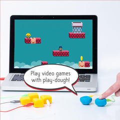 Makey Makey kids building scene captures creativity and hands-on exploration.