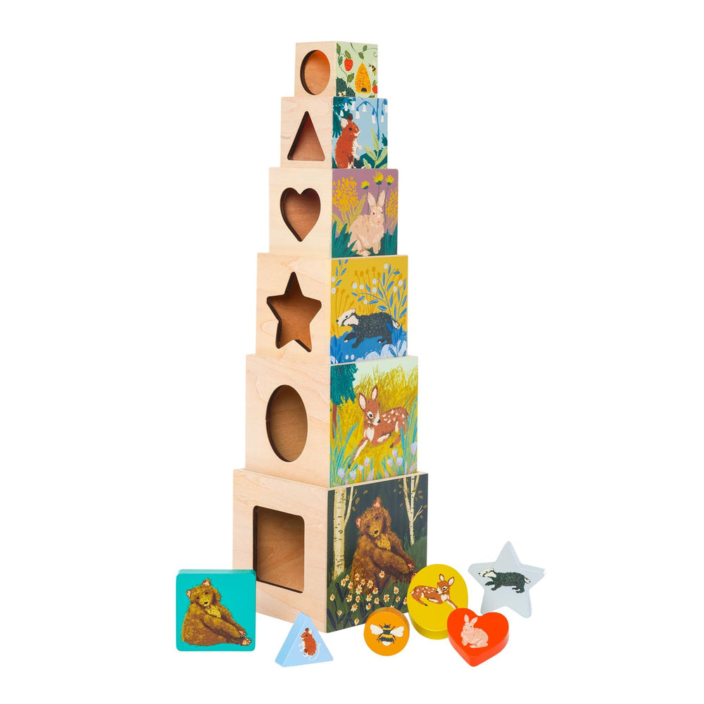 Manhattan Toy Enchanted Forest blocks stacked tall encourage imaginative play and color matching.