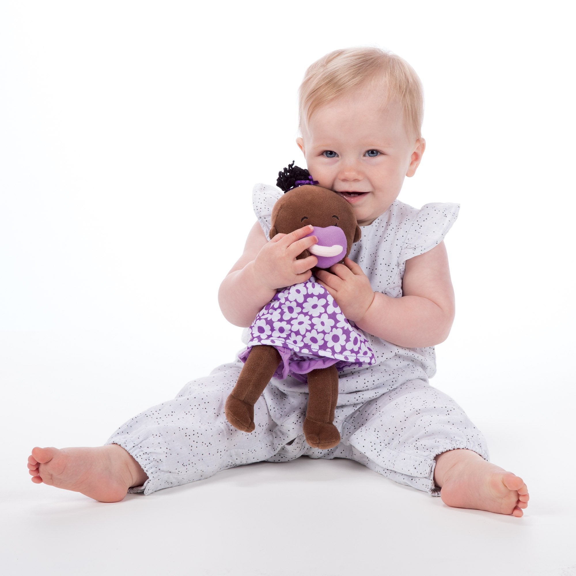Manhattan Toy Wee Baby Stella Brown doll outfits—interchangeable clothing for creative role-play.