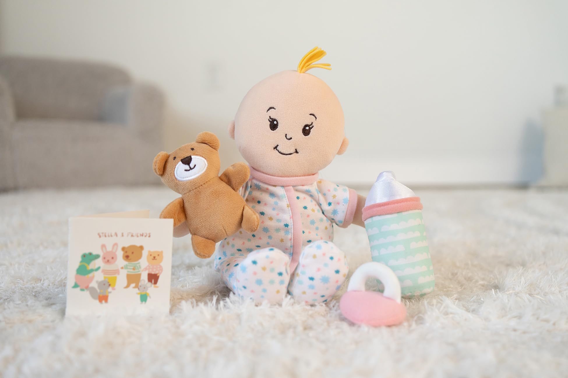 Manhattan Toy Wee Baby Stella soft doll closeup highlights embroidered features.