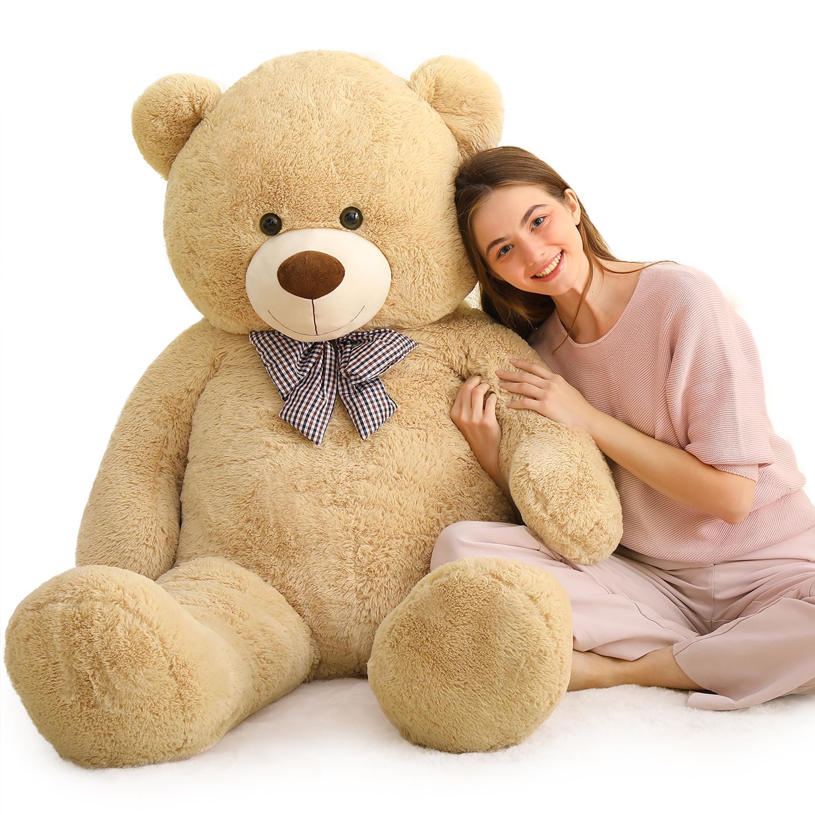 MaoGoLan Giant Teddy Bear in a cozy bedroom setup enhances warm ambiance.