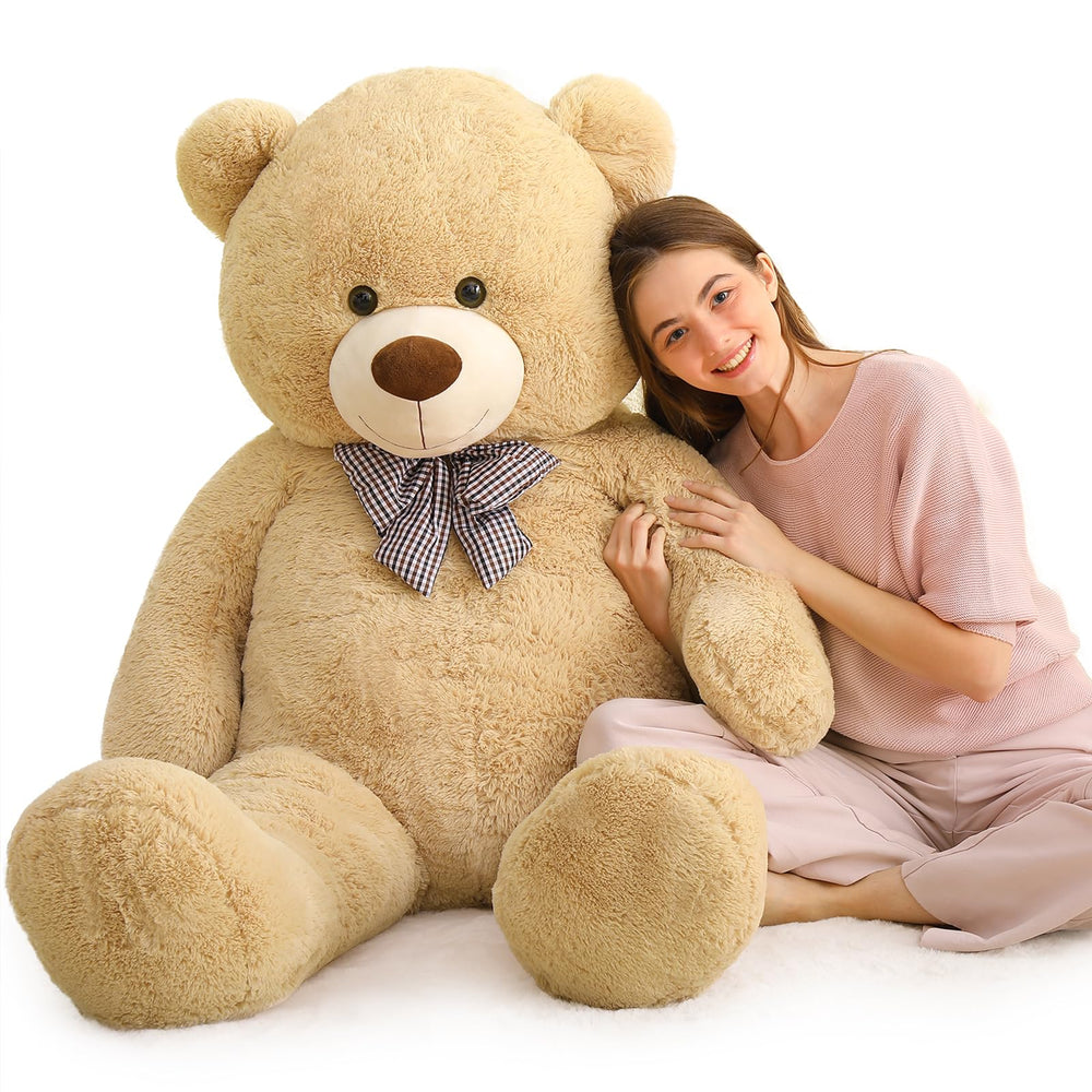 MaoGoLan Giant Teddy Bear in a cozy bedroom setup enhances warm ambiance.
