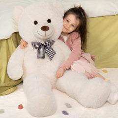 Life-size 47-inch teddy bear with a person for scale and home décor style.