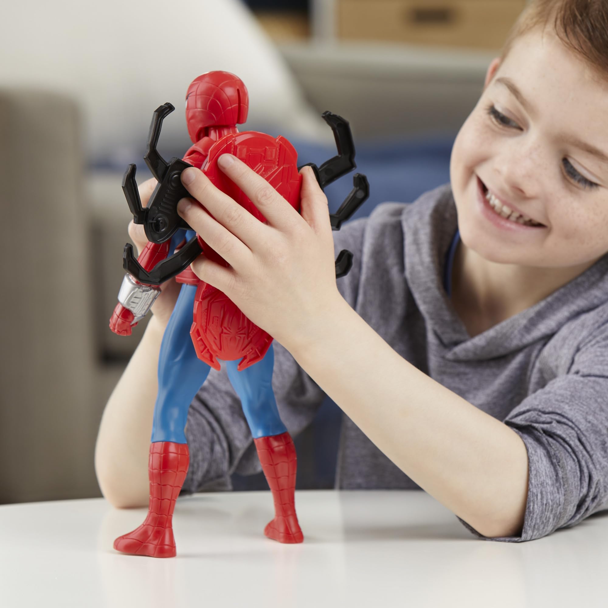 Marvel Spider-Man right-arm blast pose demonstrates web projectile firing.