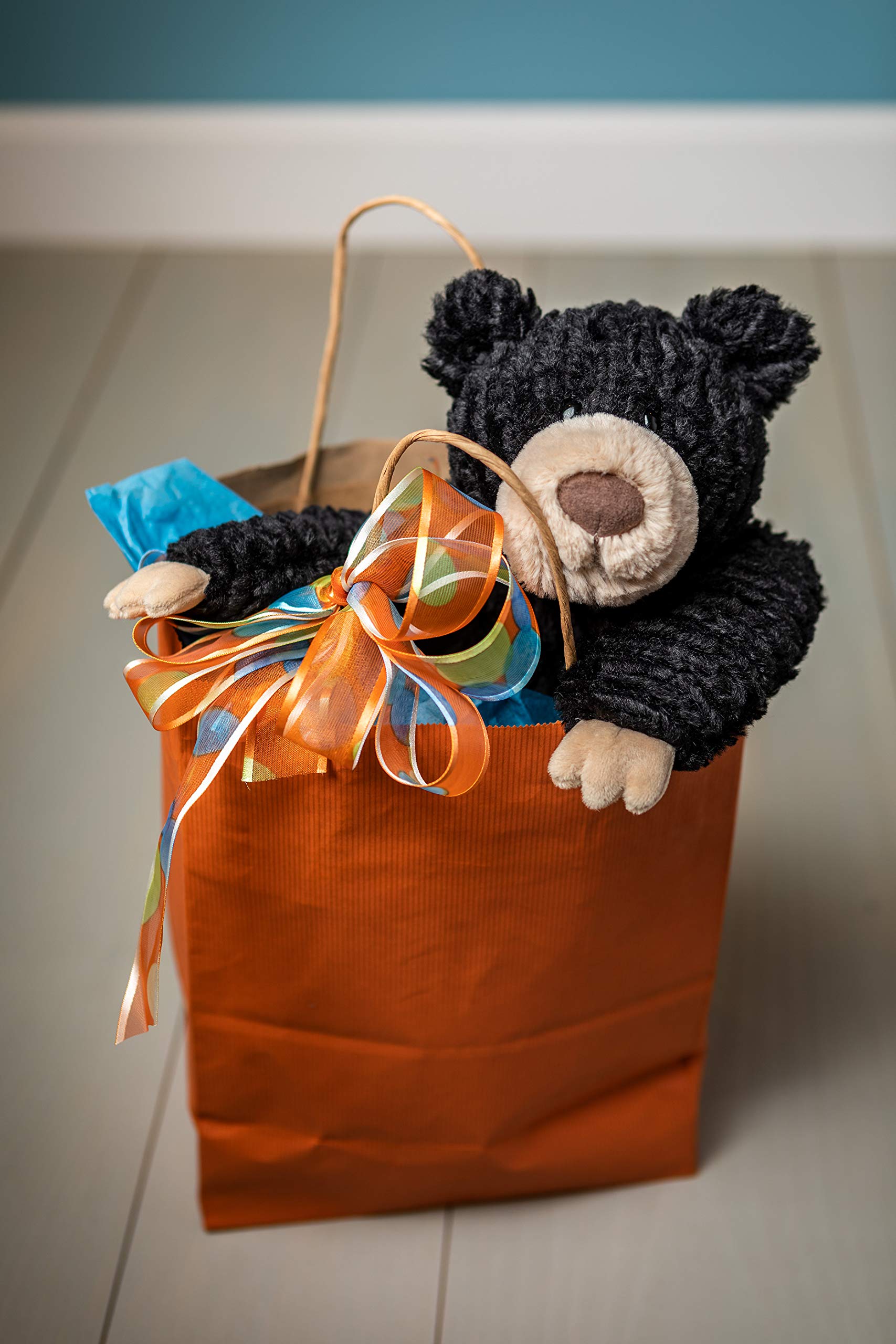 Mary Meyer Cozy Toes Black Bear hanging pose ready for storytelling adventures.