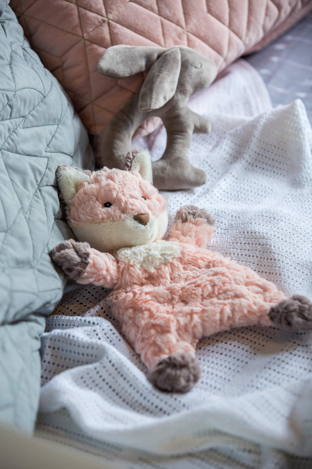 Embroidered eyes on the Putty Fox Lovey for gentle visual detail.