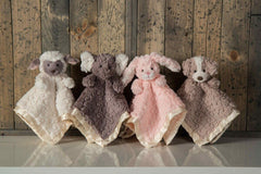 Putty Lamb features creamy white body with taupe face and accents