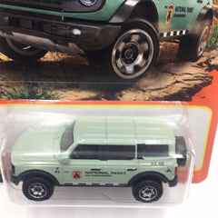 Matchbox Ford Bronco mint green side view highlights detailed wheels for collectors