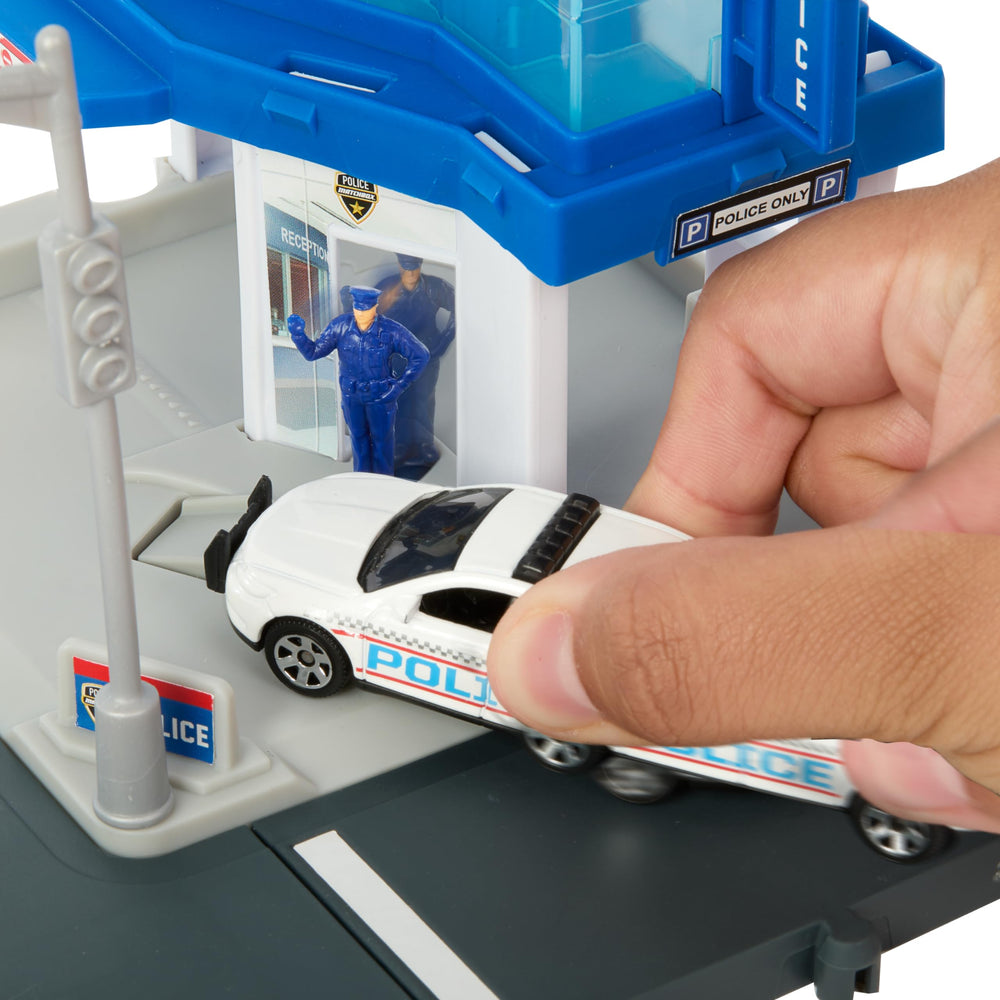 Matchbox Police Gate opens as the car leaves, inviting new missions.