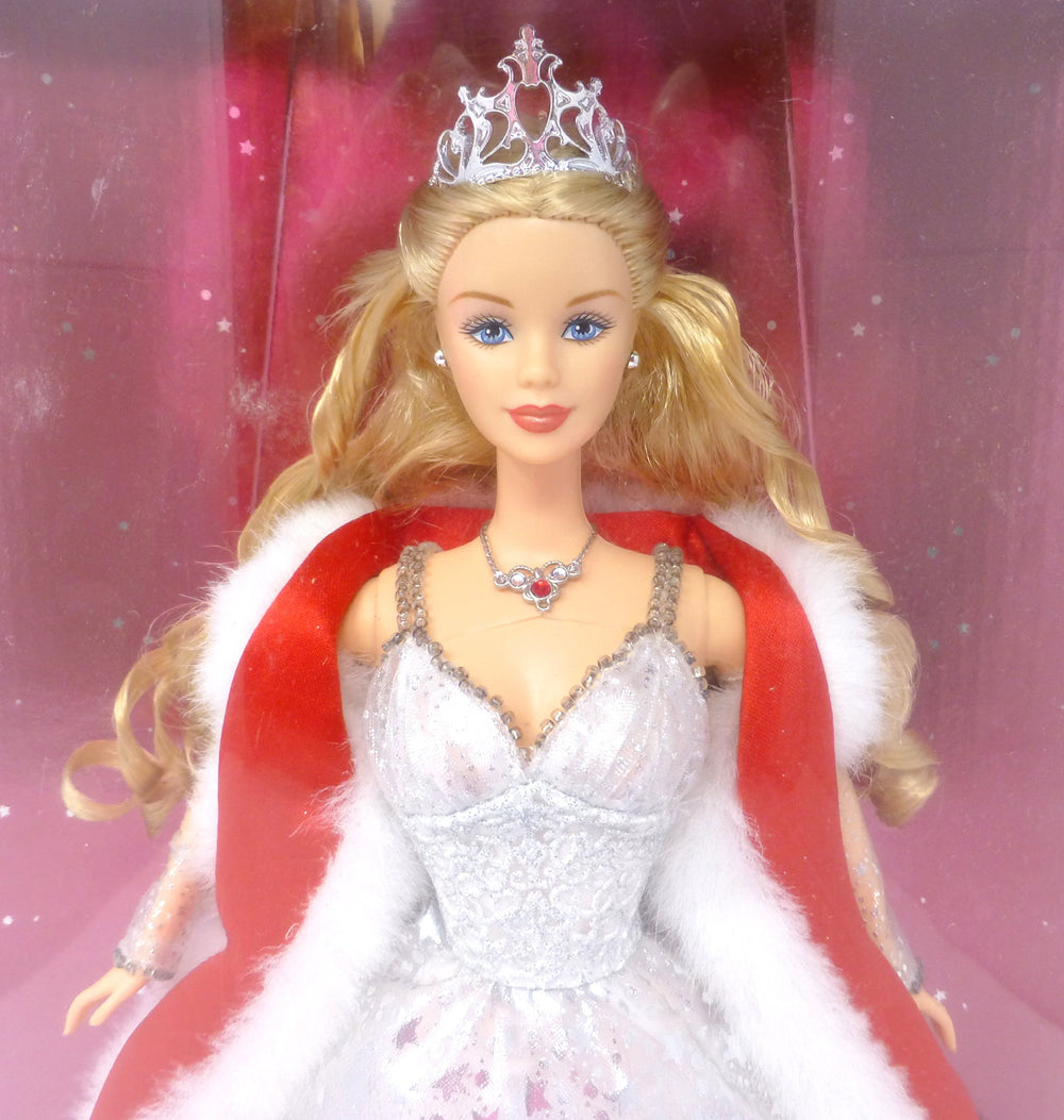 Mattel Barbie Holiday Celebration 2001 with red mantle and faux fur trim, perfect for festive sets.