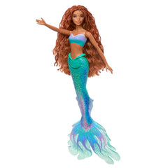 Vibrant colors and glitter details make this doll a great gift idea
