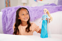Mattel Elsa doll in blue outfit with removable cape for scene recreations