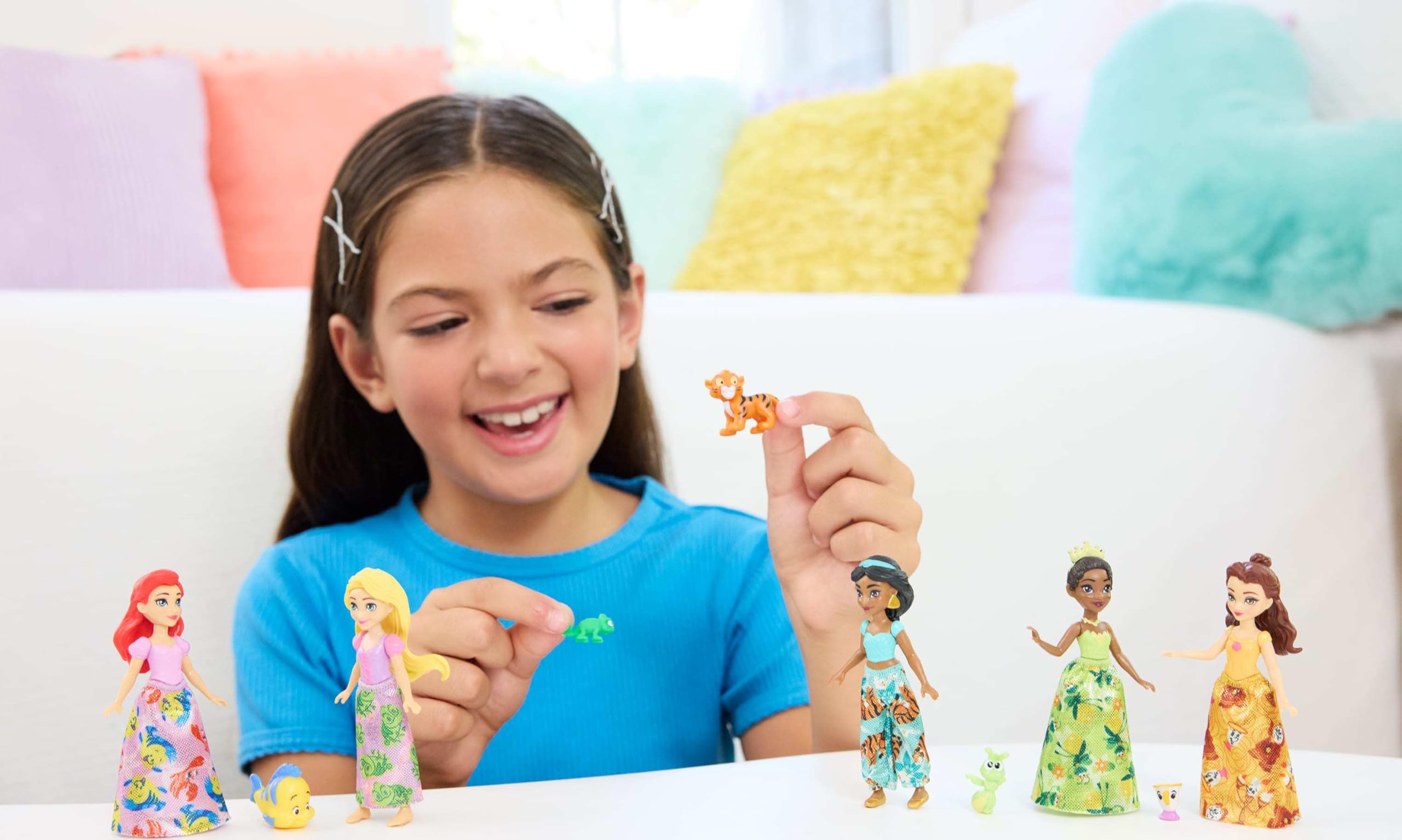 Removable skirts and pants enable mix-and-match outfits for creative play.