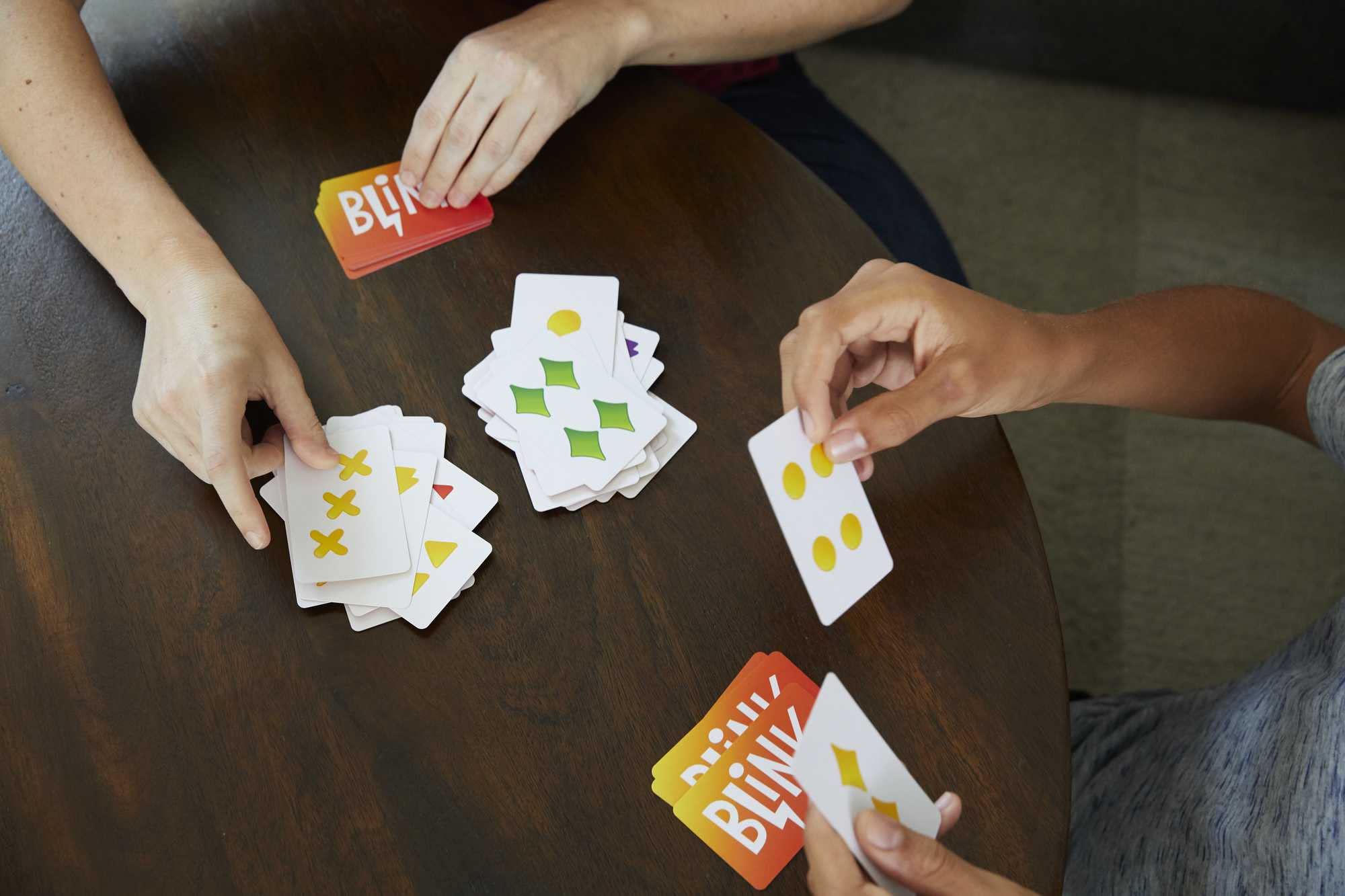 Mattel Games Blink two players race to empty hands for fast rounds.