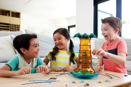 Mattel Games KerPlunk tree tower rocks during playtime.