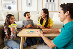 Mattel Games ONO 99 card game in play with players adding totals under 99