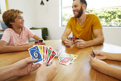 Mattel Games UNO collectible tin box keeps cards organized for travel.