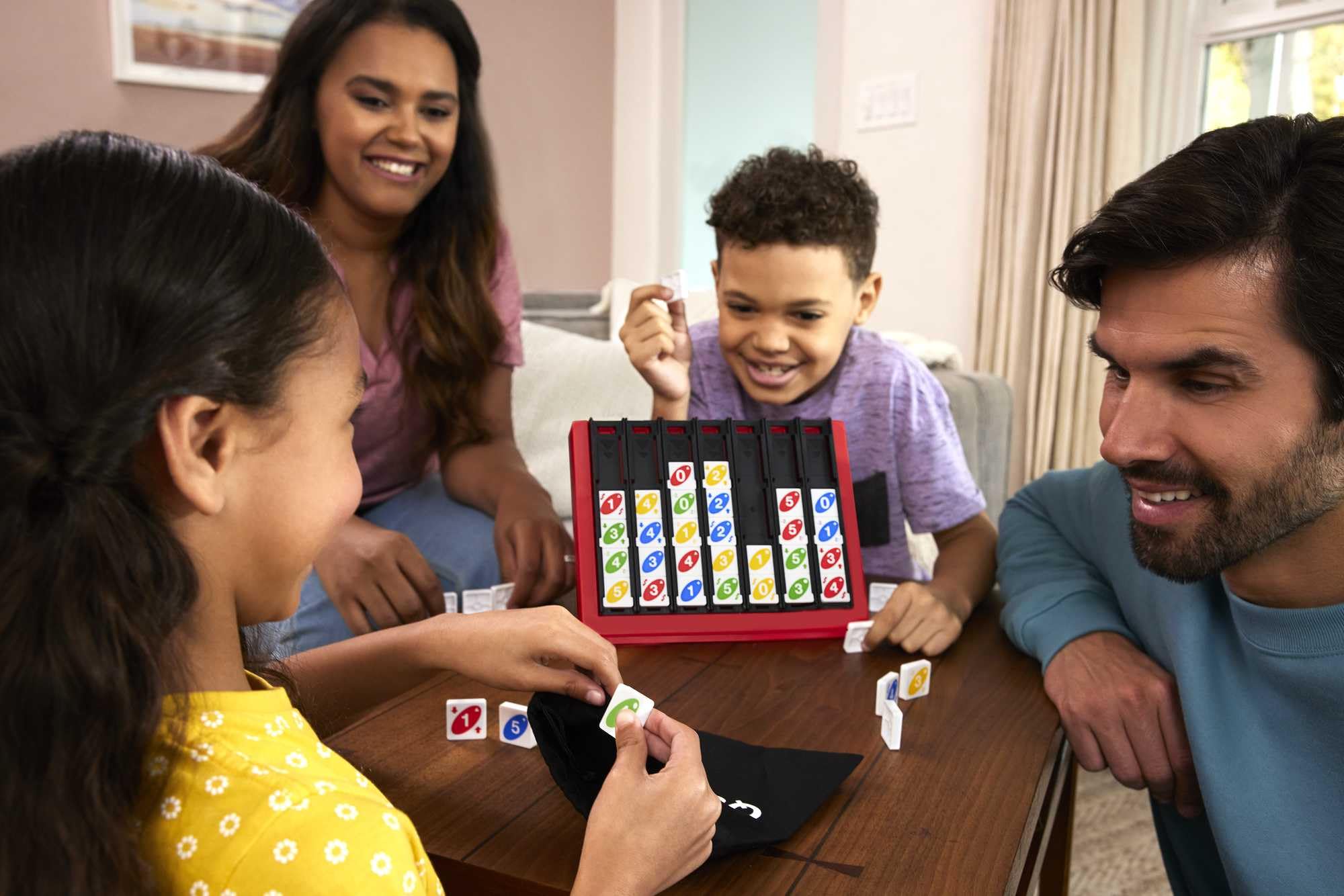 Mattel Games UNO Quatro tiles close-up show bright colors for fast, family-friendly rounds.