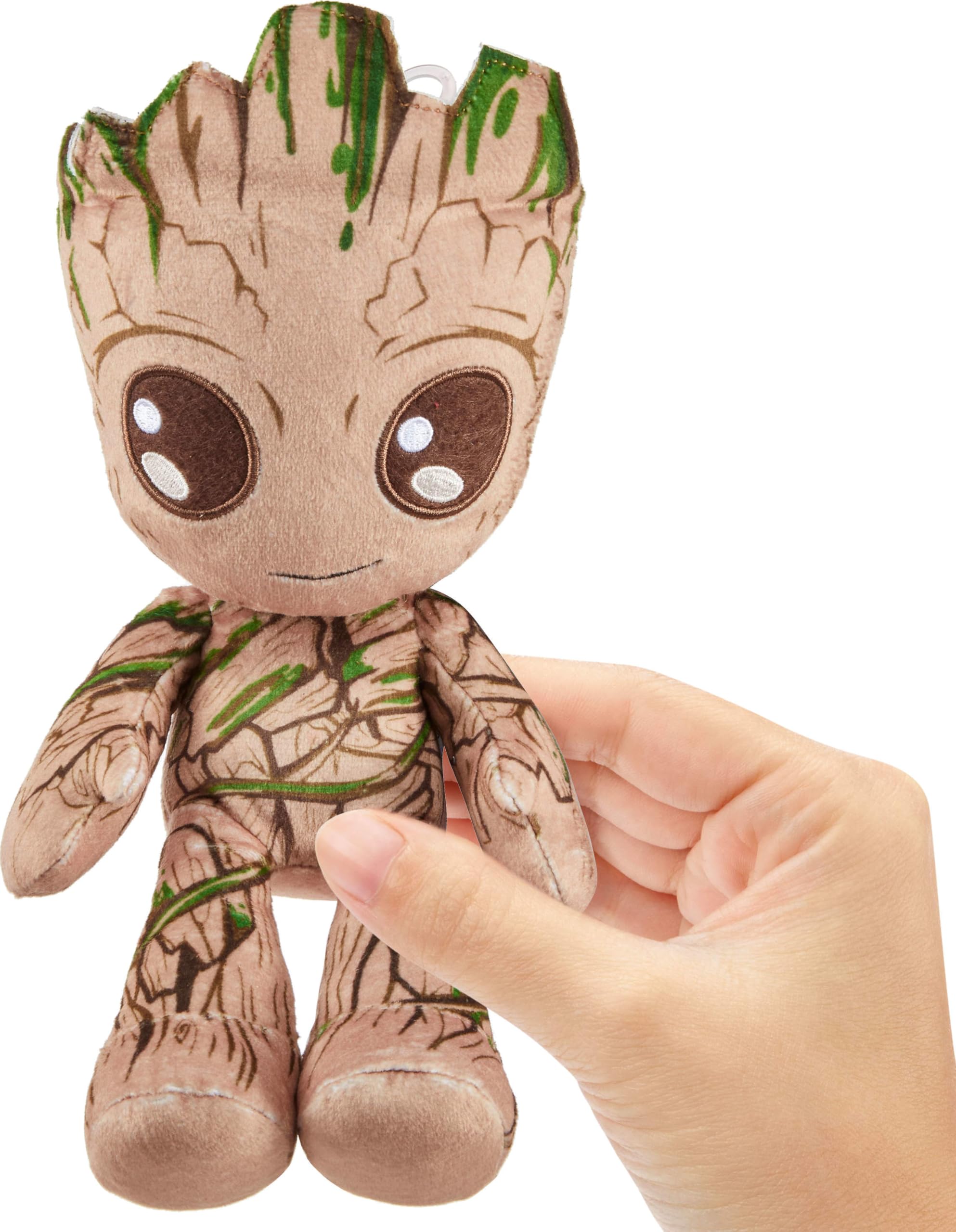 Metallic shimmer accents on Mattel Groot plush boost shelf appeal.