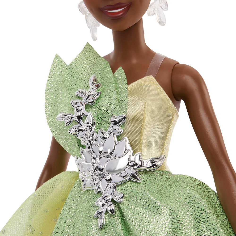 Mattel Tiana hair updo and tiara showcase gleaming accents and luxe styling.