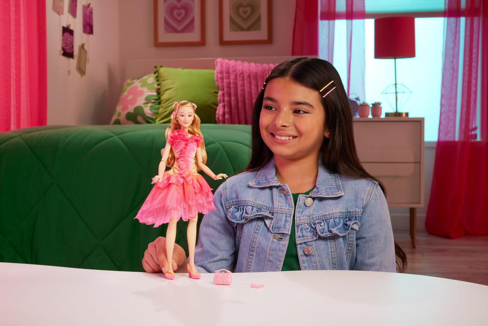 Mattel Wicked Glinda ball gown dress showcases pink ombre details and ruffles.