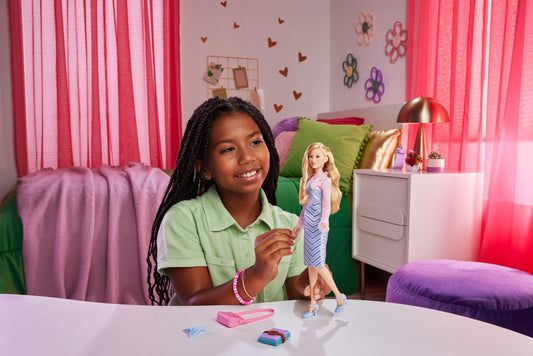 Mattel Wicked Glinda wearing blue-striped dress for storytelling and dress-up.