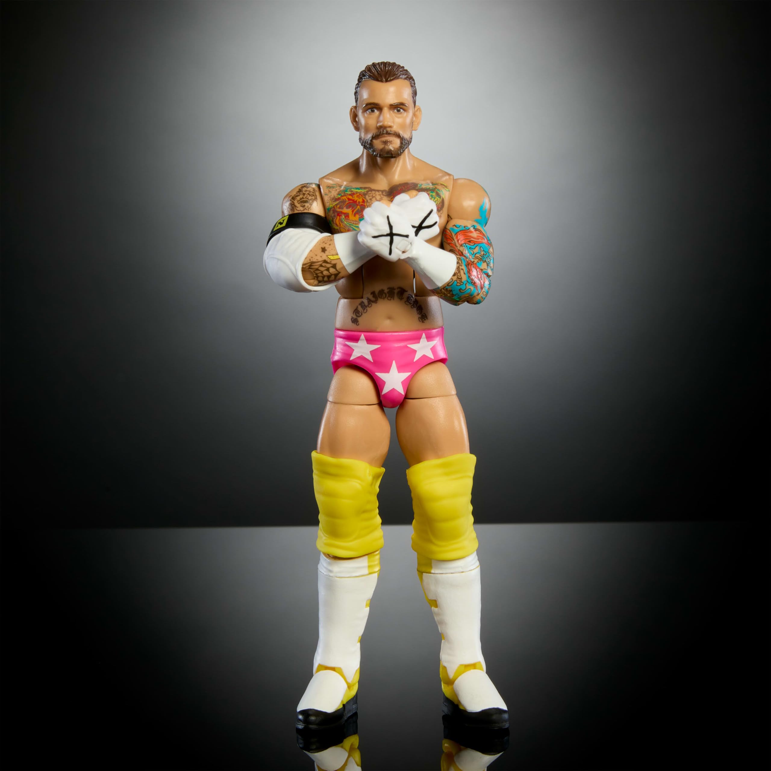 Mattel WWE Elite CM Punk accessories enhance authentic ring-ready setups.