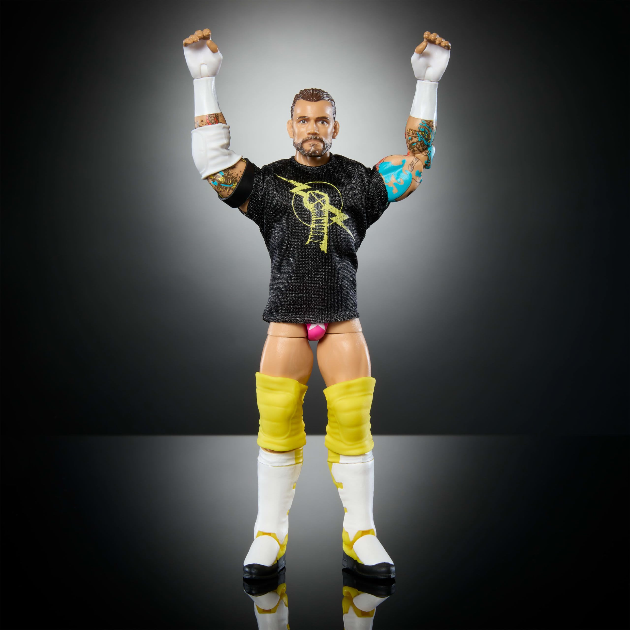 Mattel WWE Elite CM Punk figure in dynamic pose ready for action.