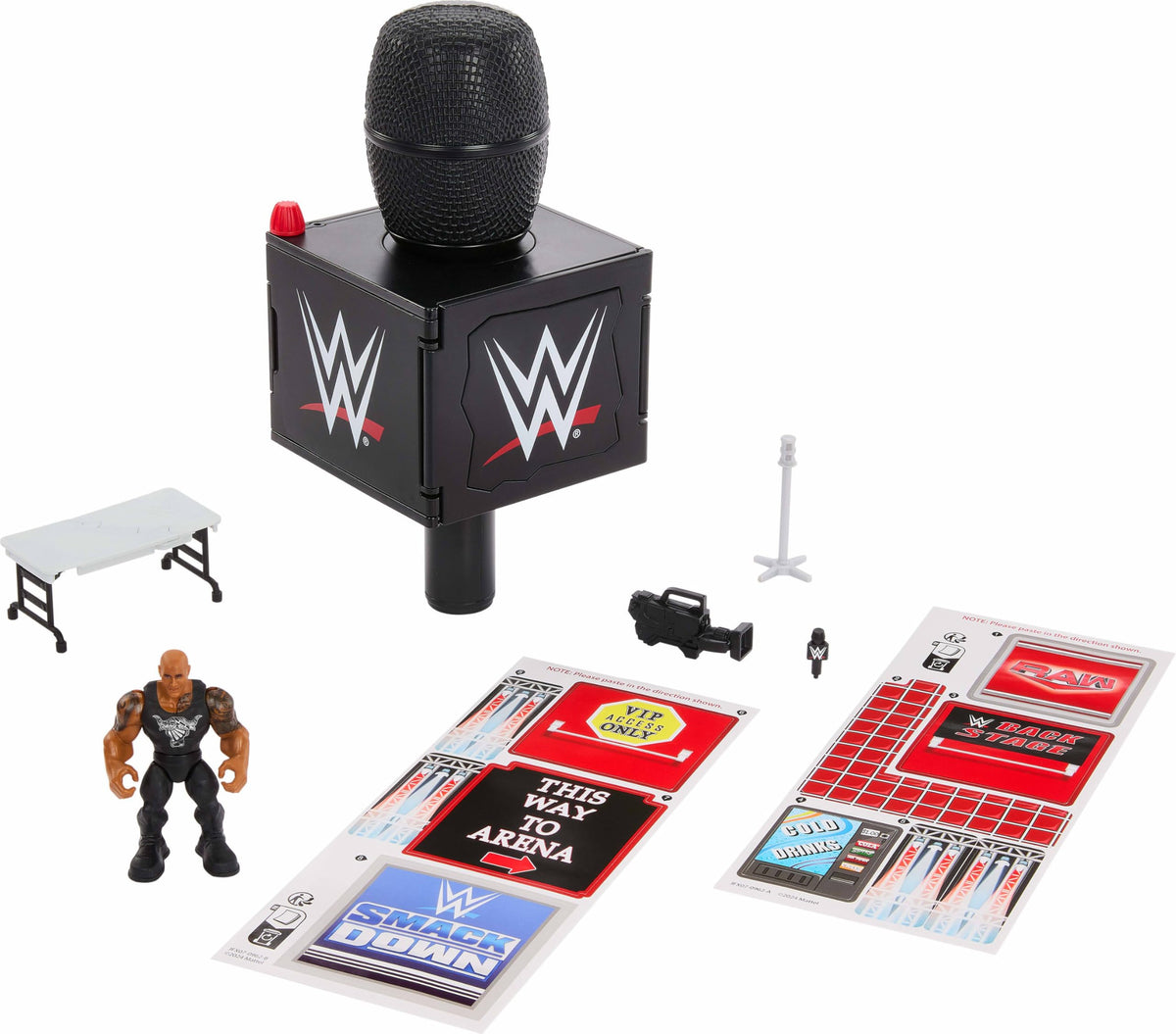 Mattel WWE Knuckle Crunchers final boss microphone opens to reveal a backstage diorama for imaginative play.