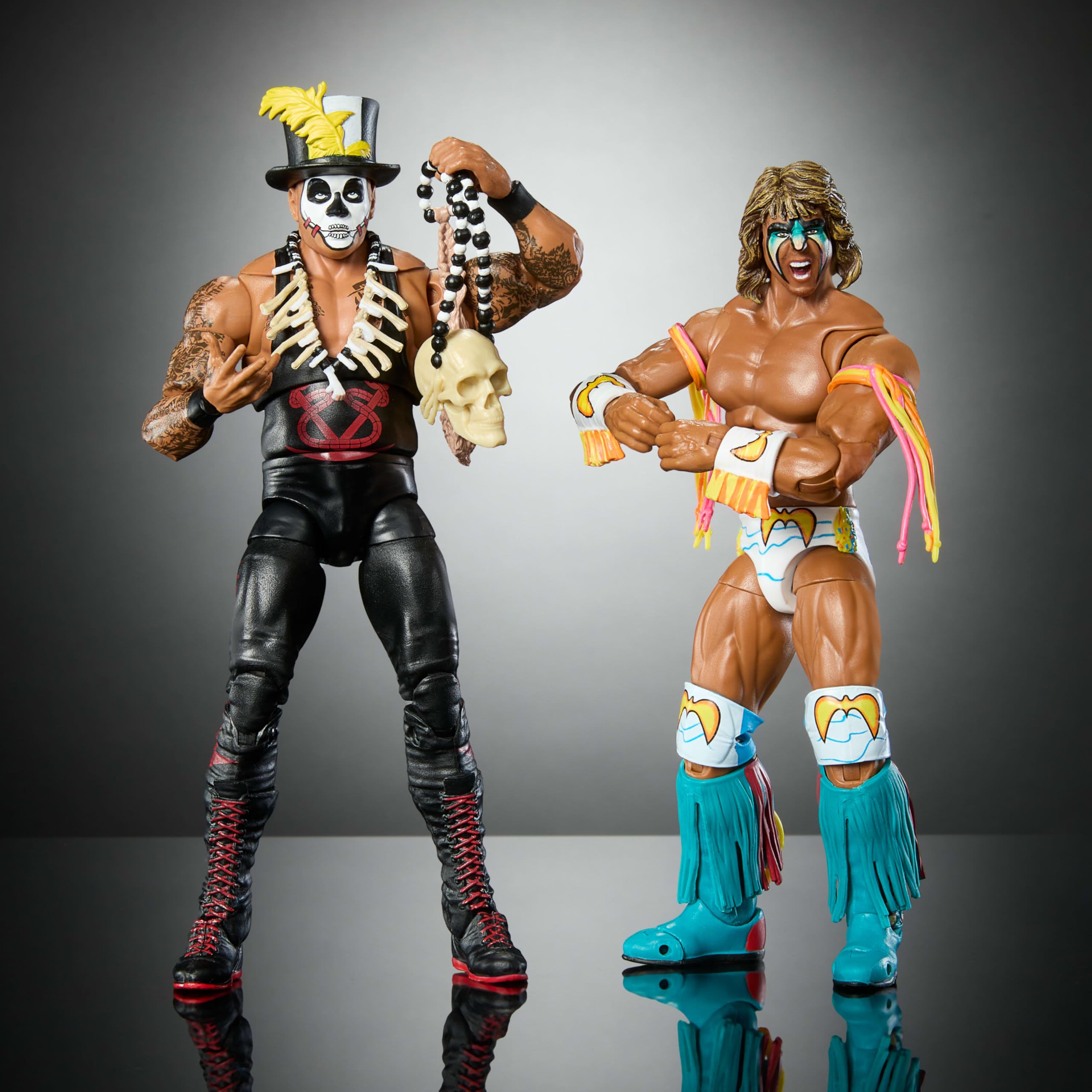 Mattel WWE Ultimate Edition figures with multiple heads and hands for dynamic poses.