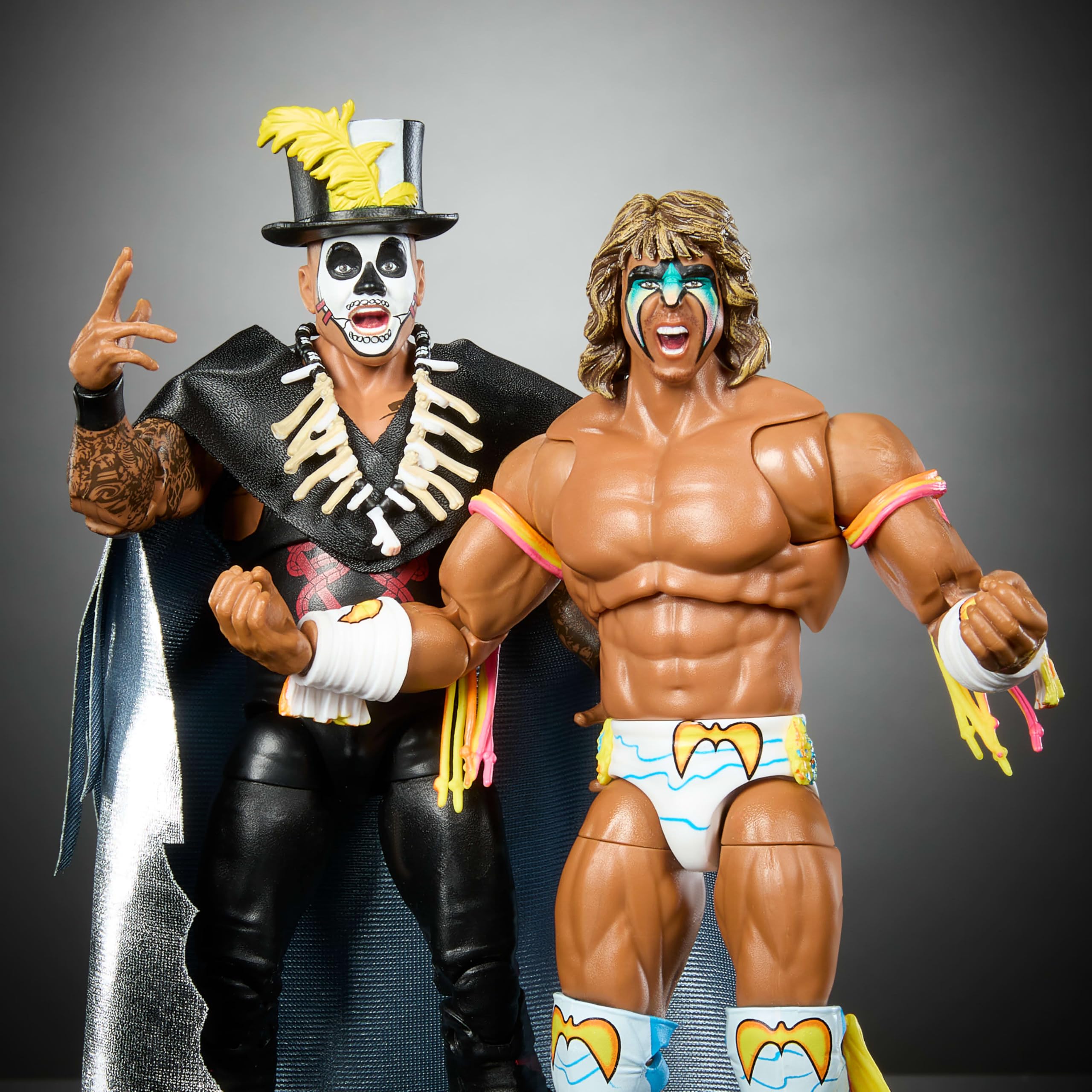Mattel WWE Ultimate Edition two-pack figures on display with interchangeable parts.