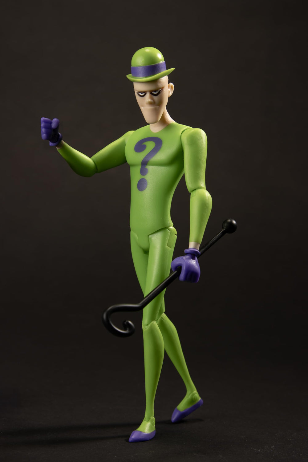Vivid green and purple suit texture stands out on the shelf.