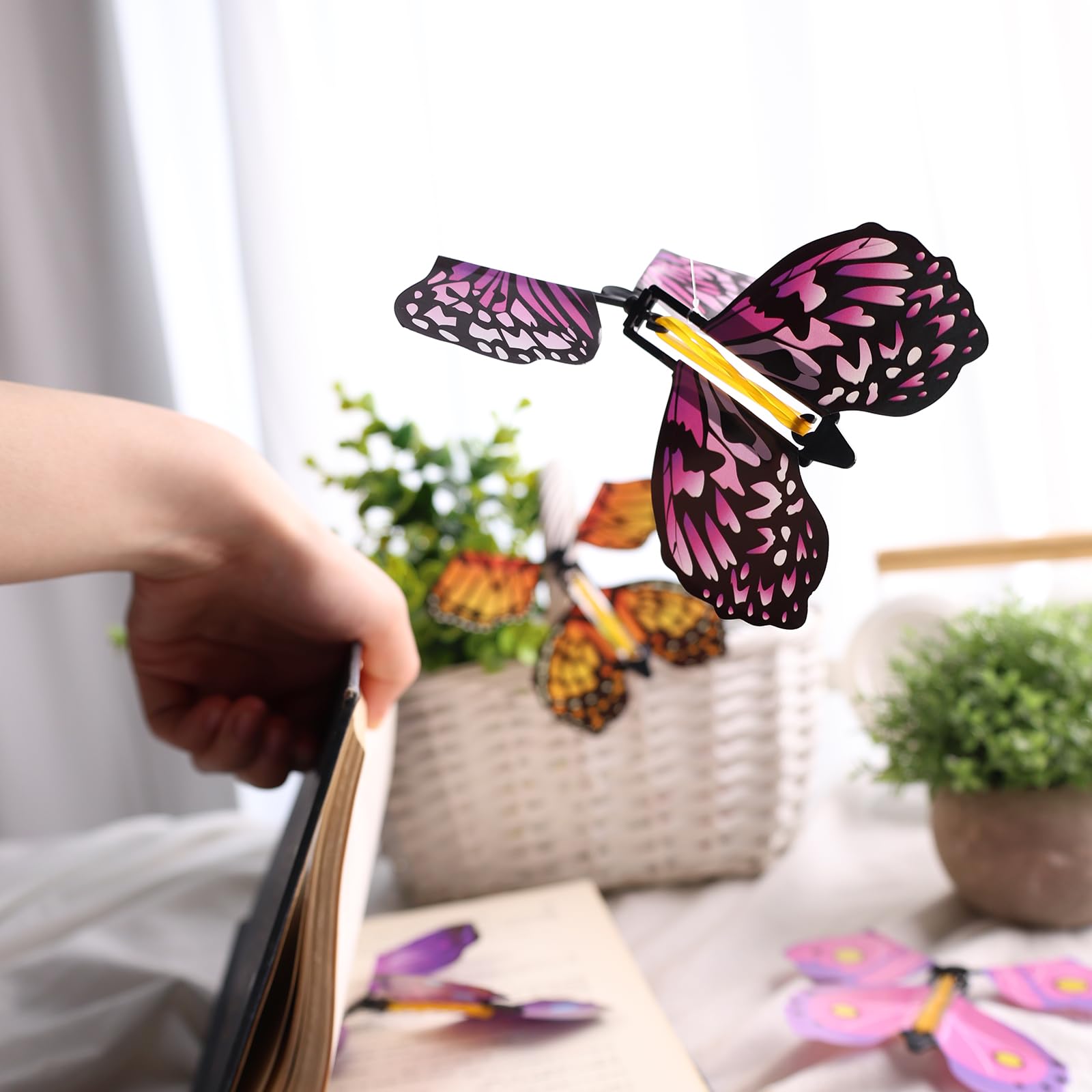 MCPINKY butterfly emerging from a card creates a delightful surprise.