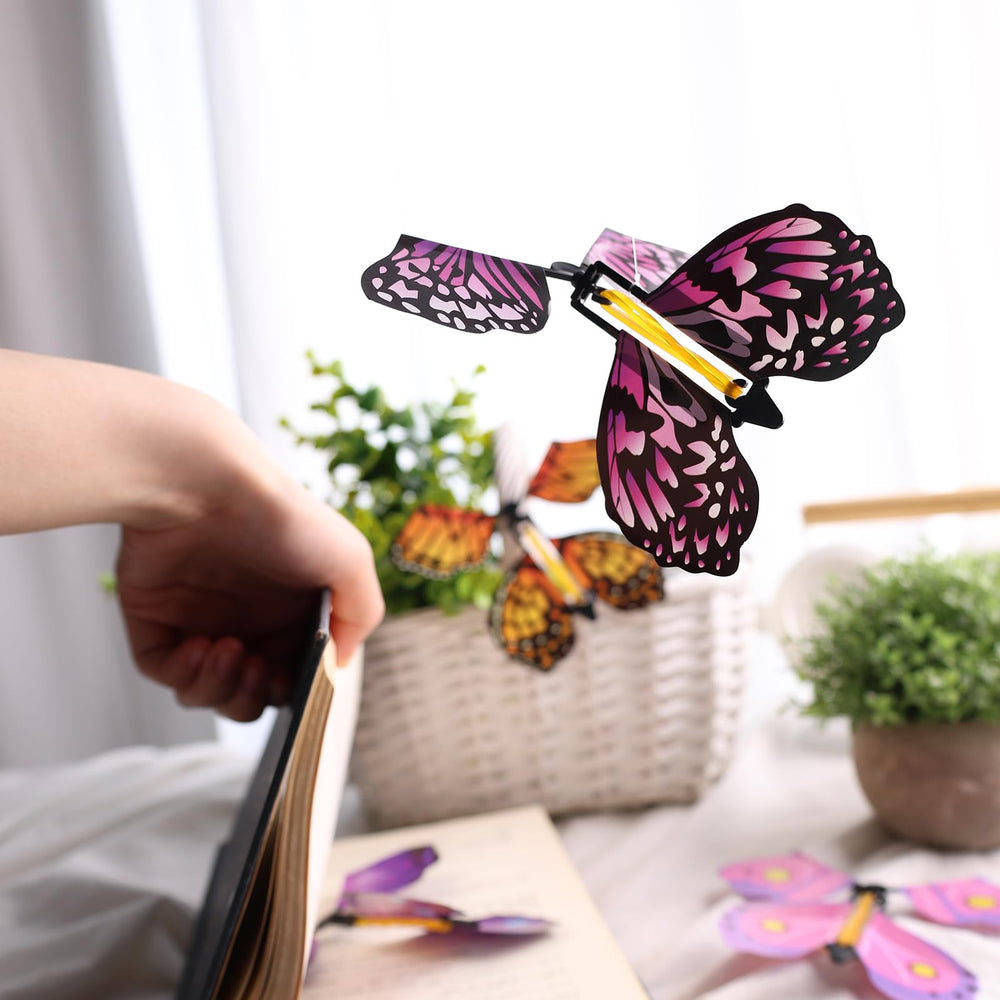MCPINKY butterfly emerging from a card creates a delightful surprise.