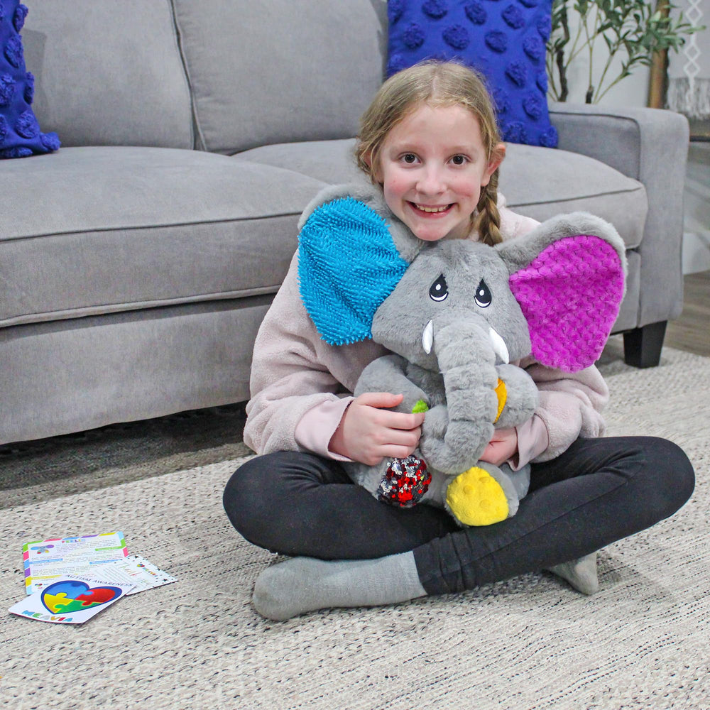 MEAVIA Ellie sits comfortably on couch during quiet play