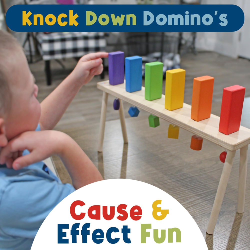 Child pulls a shape to reset, practicing fine motor skills.