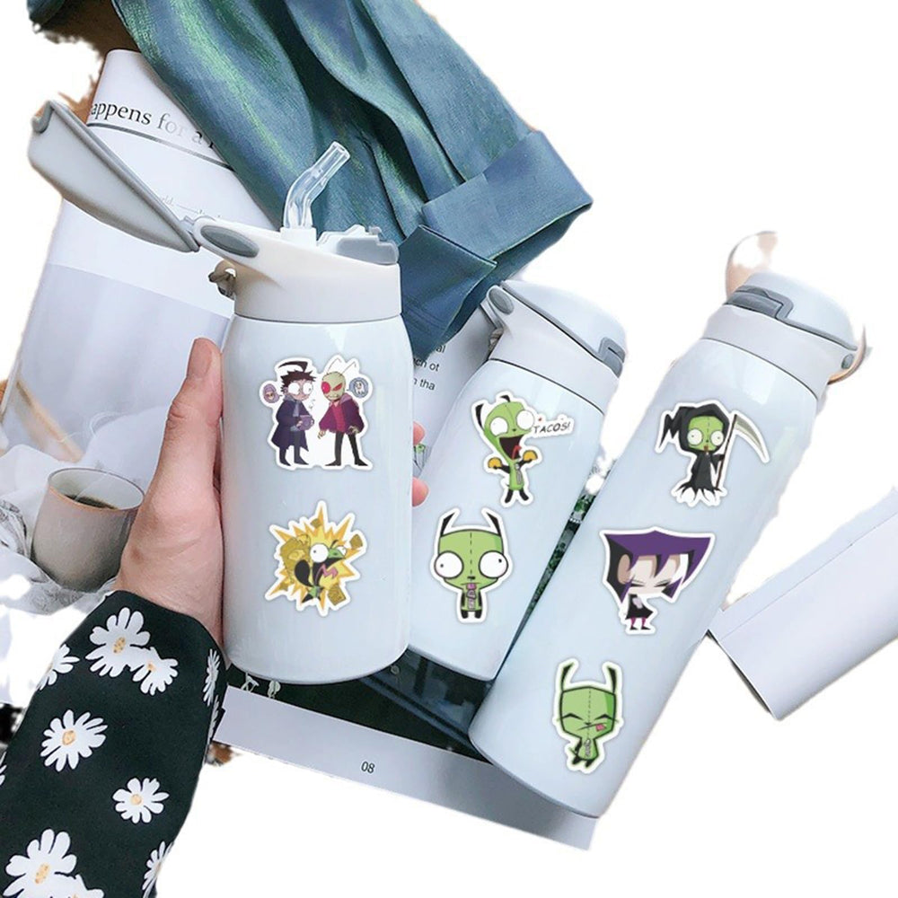 Meet Holiday Invader luggage sticker, easy to spot and personalize travel cases.