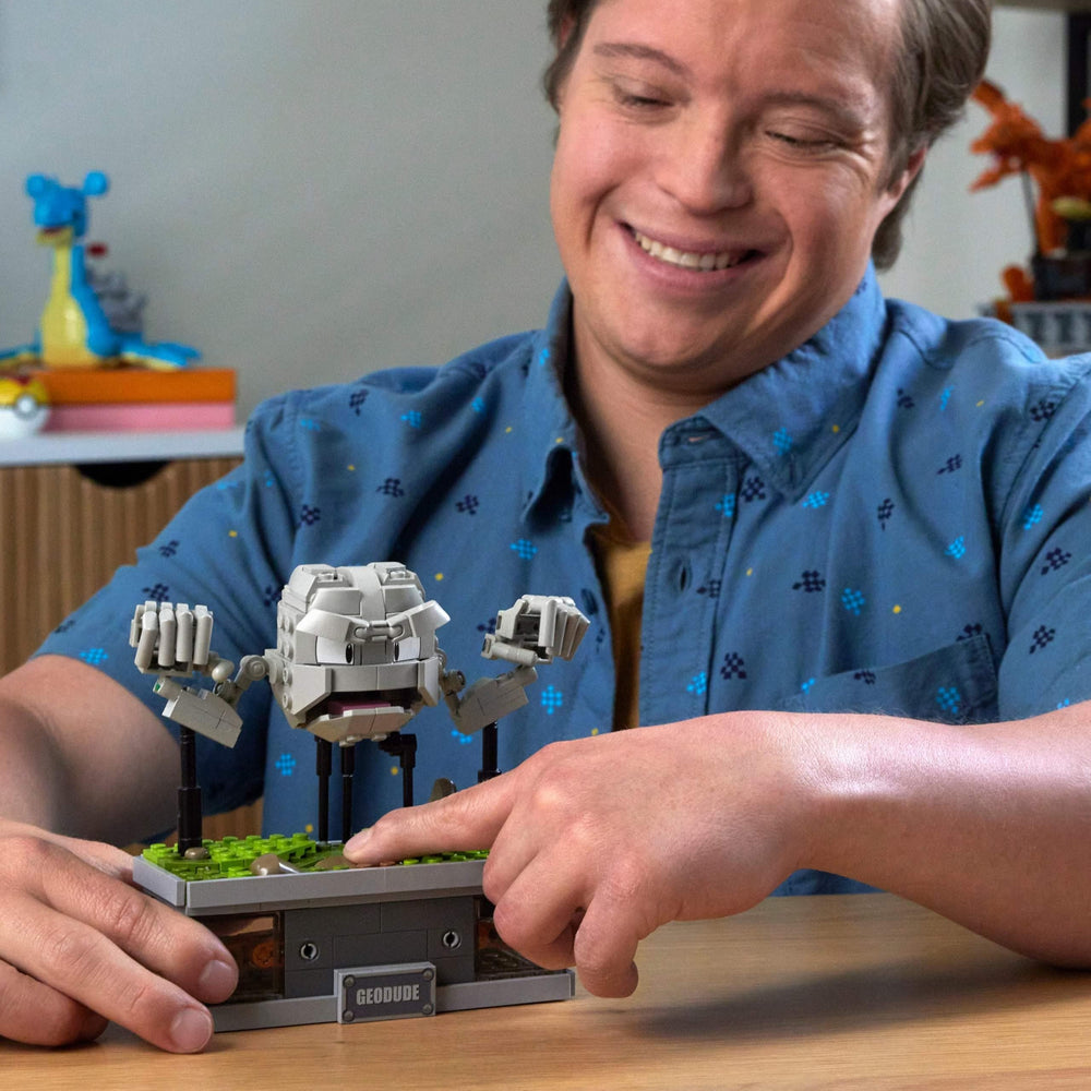 Mega Brands Geodude hidden-button motion activates punching action for playful interaction.